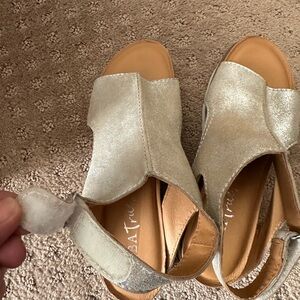 Sandals never been worn. Can dress them up and wear causally.